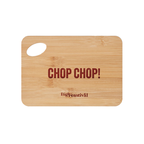 A rectangular wooden Chopping Board by 2025 with a handle cut-out and CHOP CHOP! in large red letters, plus Big Feastival printed below in smaller font.