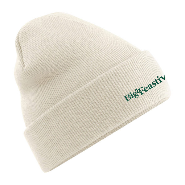 The 2025 Beanie Hat is a cream knit beanie with a folded brim, featuring BigFeastiv embroidered in green on the front.